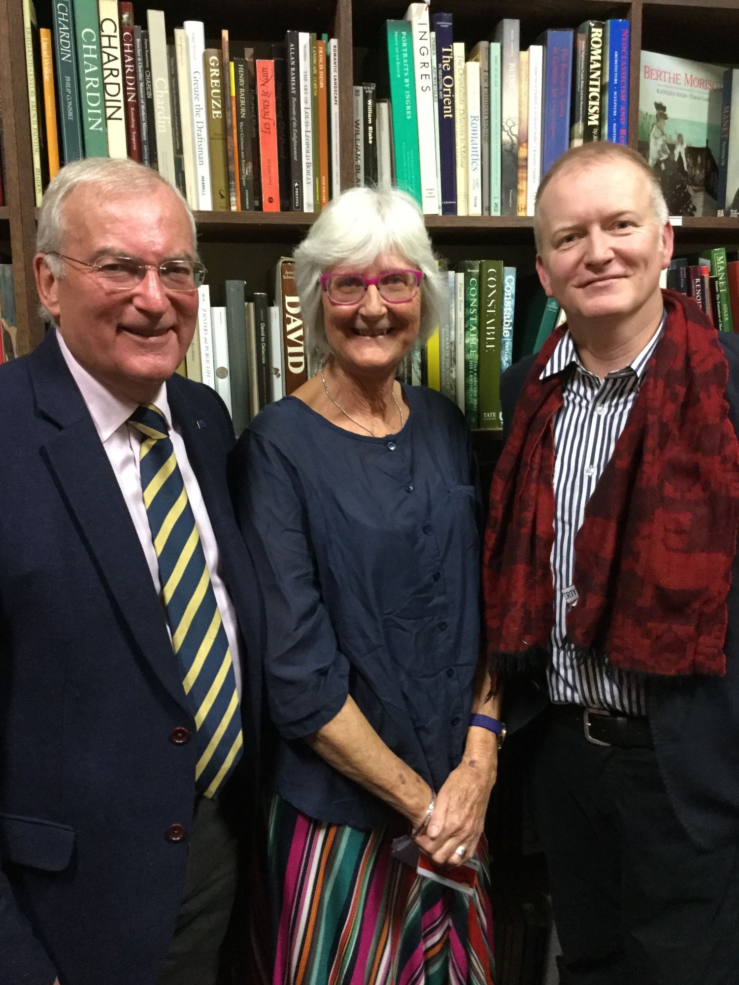 Photo of David Beardsley, Celia Westhead and Jethro Lyne standing in front of a bookcase