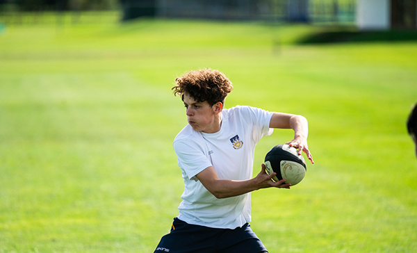 Image of a pupil playing rugby