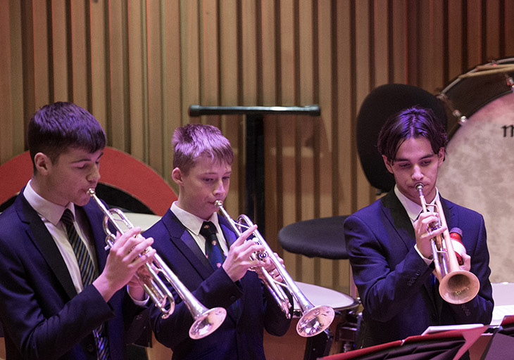 image of pupils playing trumpets