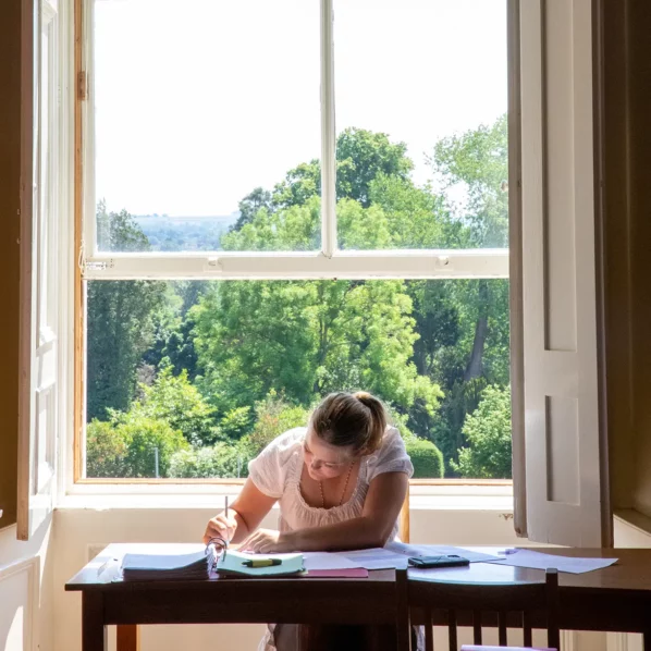Girl studying by window
