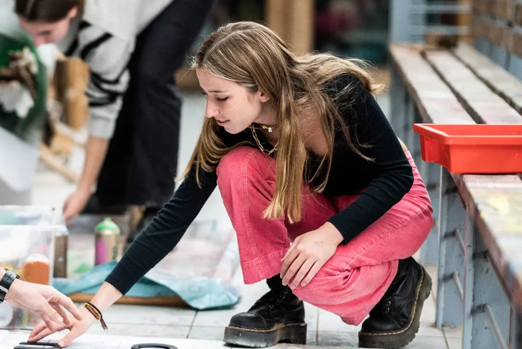 Girl doing art on floor