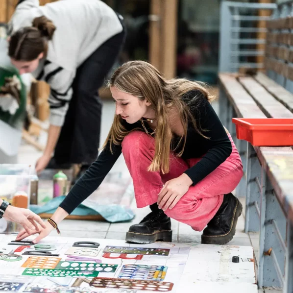 Girl doing art on floor