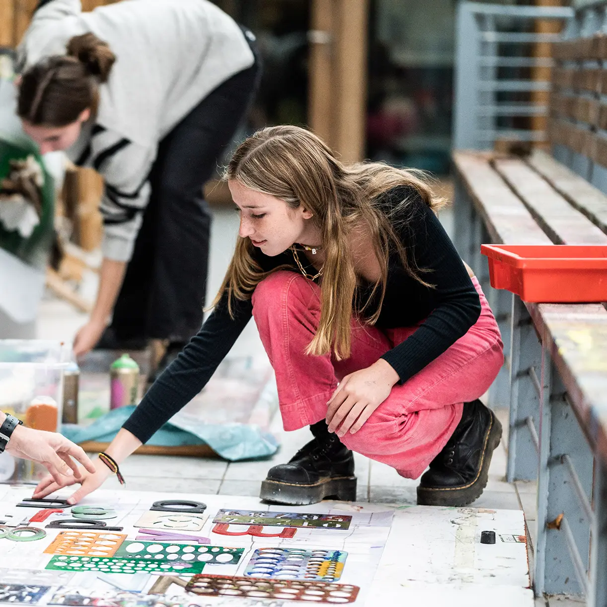 Girl doing art on floor