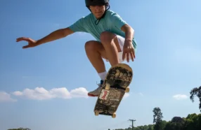 Skateboarding boy in air