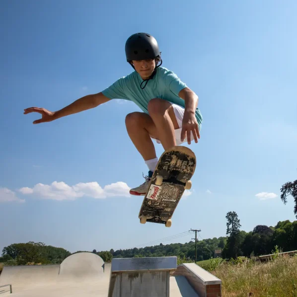Skateboarding boy in air